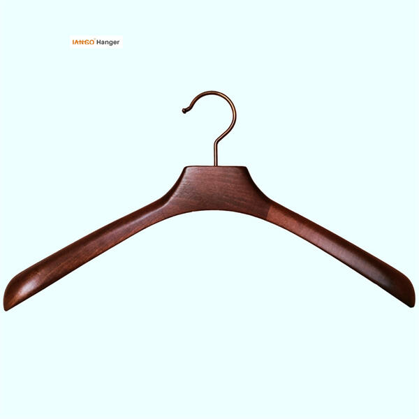 Upgrade your wardrobe organization with sleek dark wooden hangers.