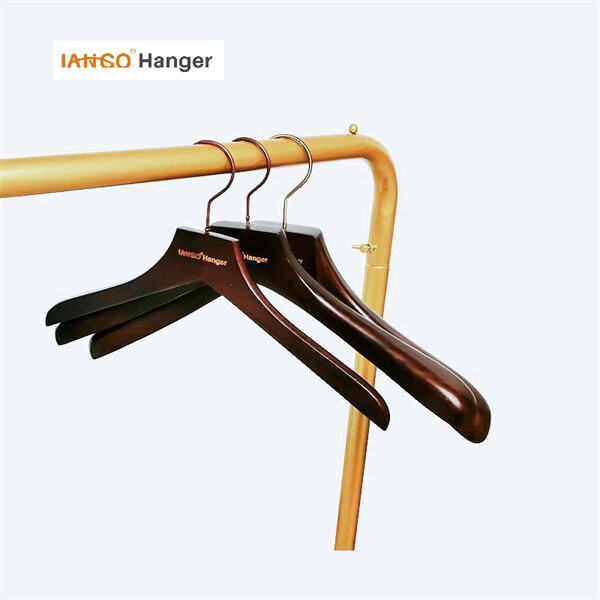 Elevate your fashion game with stylish dark wooden hangers.