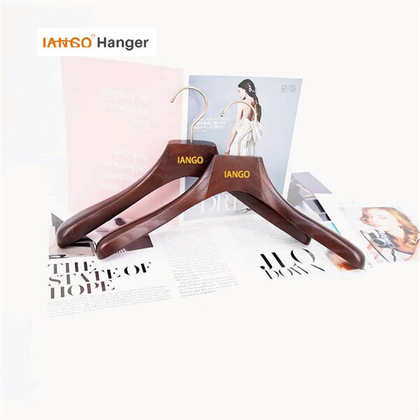 Dark wooden hangers are a must-have for any closet.