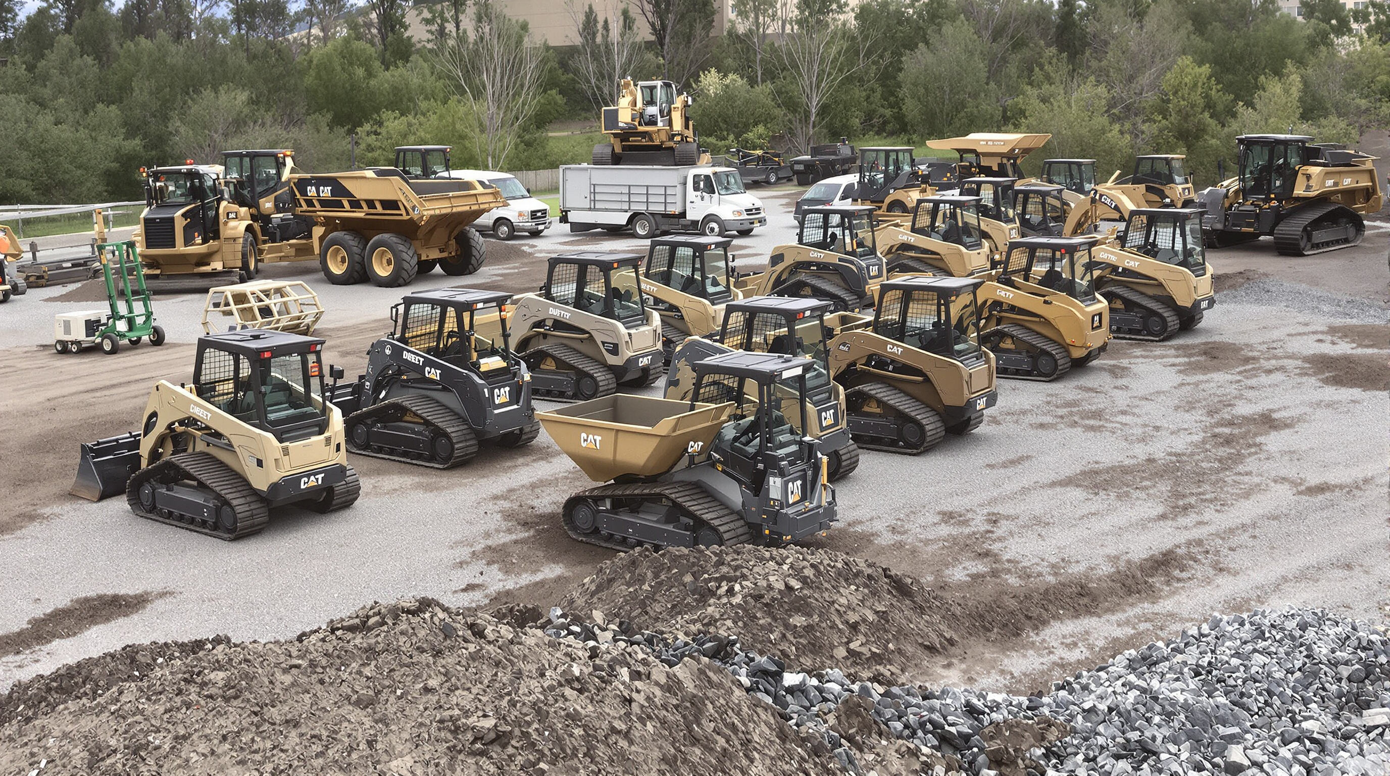 Different types of China mini dumpers—electric and diesel, tracked and wheeled—lined up on a construction site