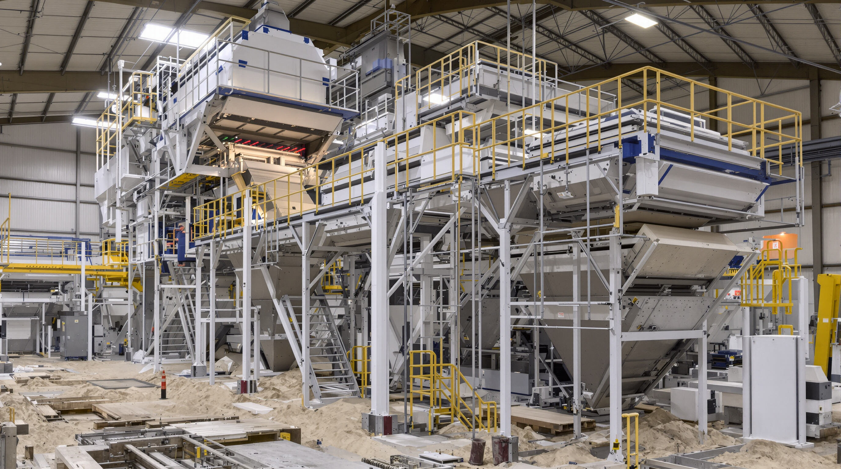 Industrial facility with both an oversized screening machine and modular multi-unit swing screens