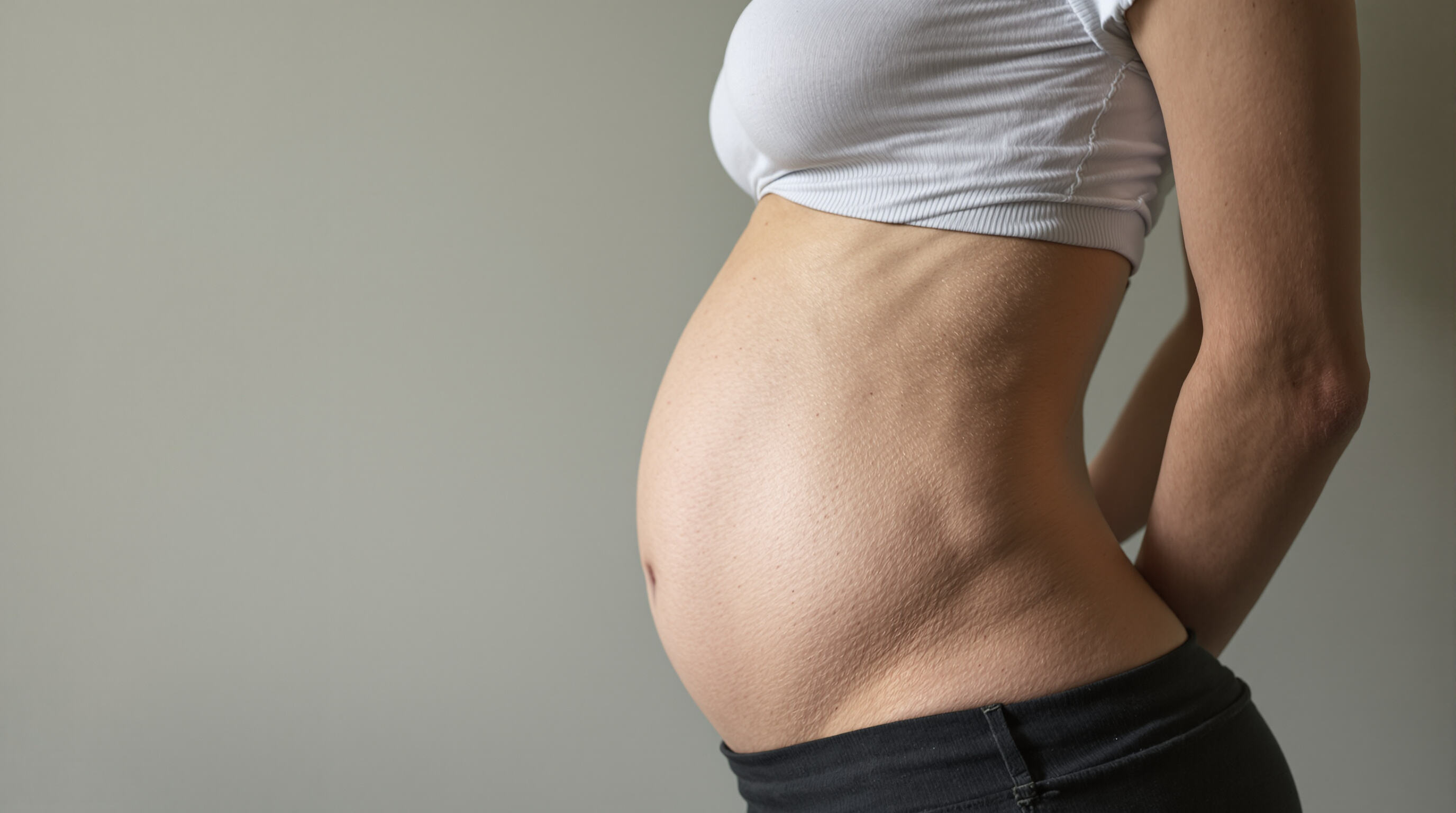 Side profile showing hourglass posture and rib area in waist training