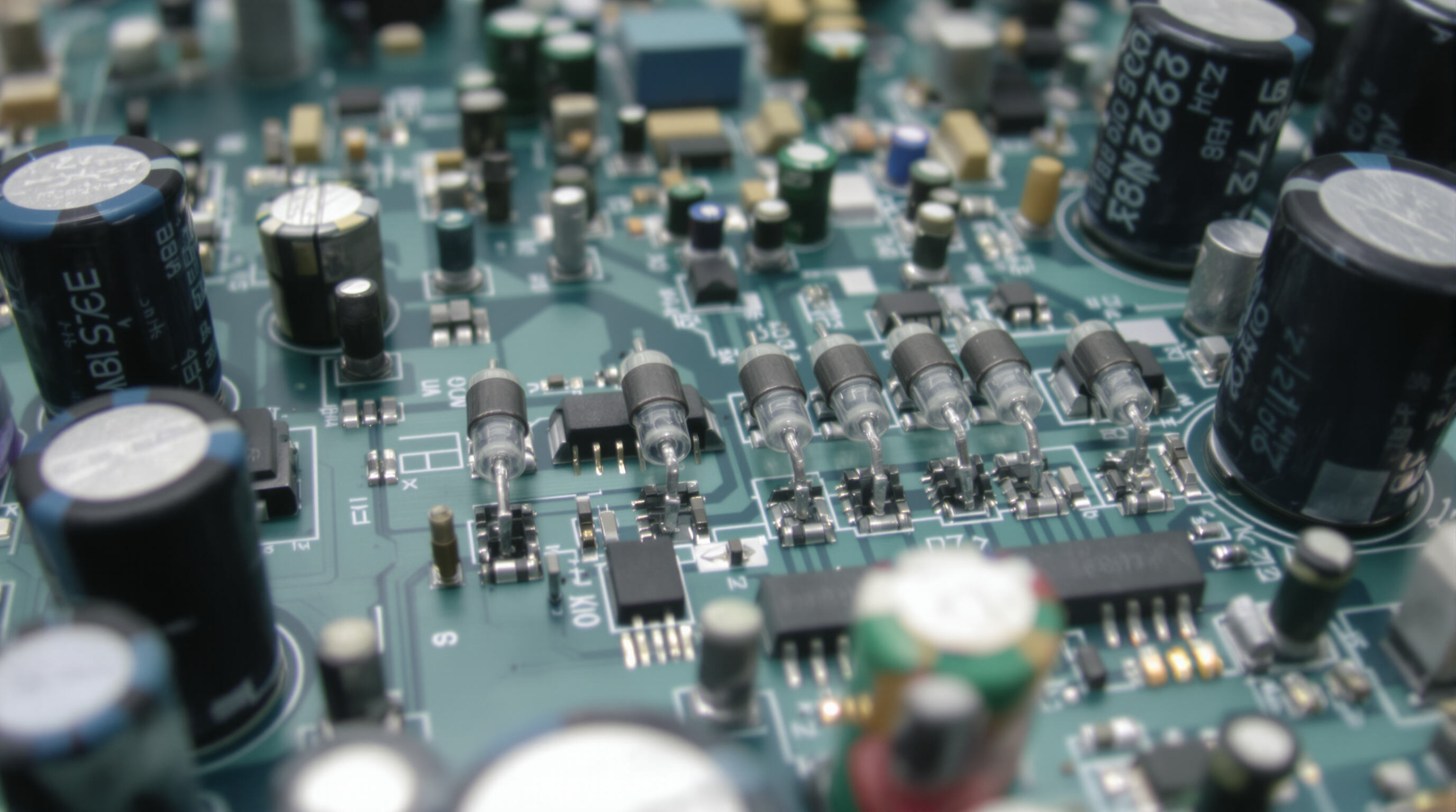 Electronic circuit board with diodes in bridge rectifier configuration and voltage regulation components
