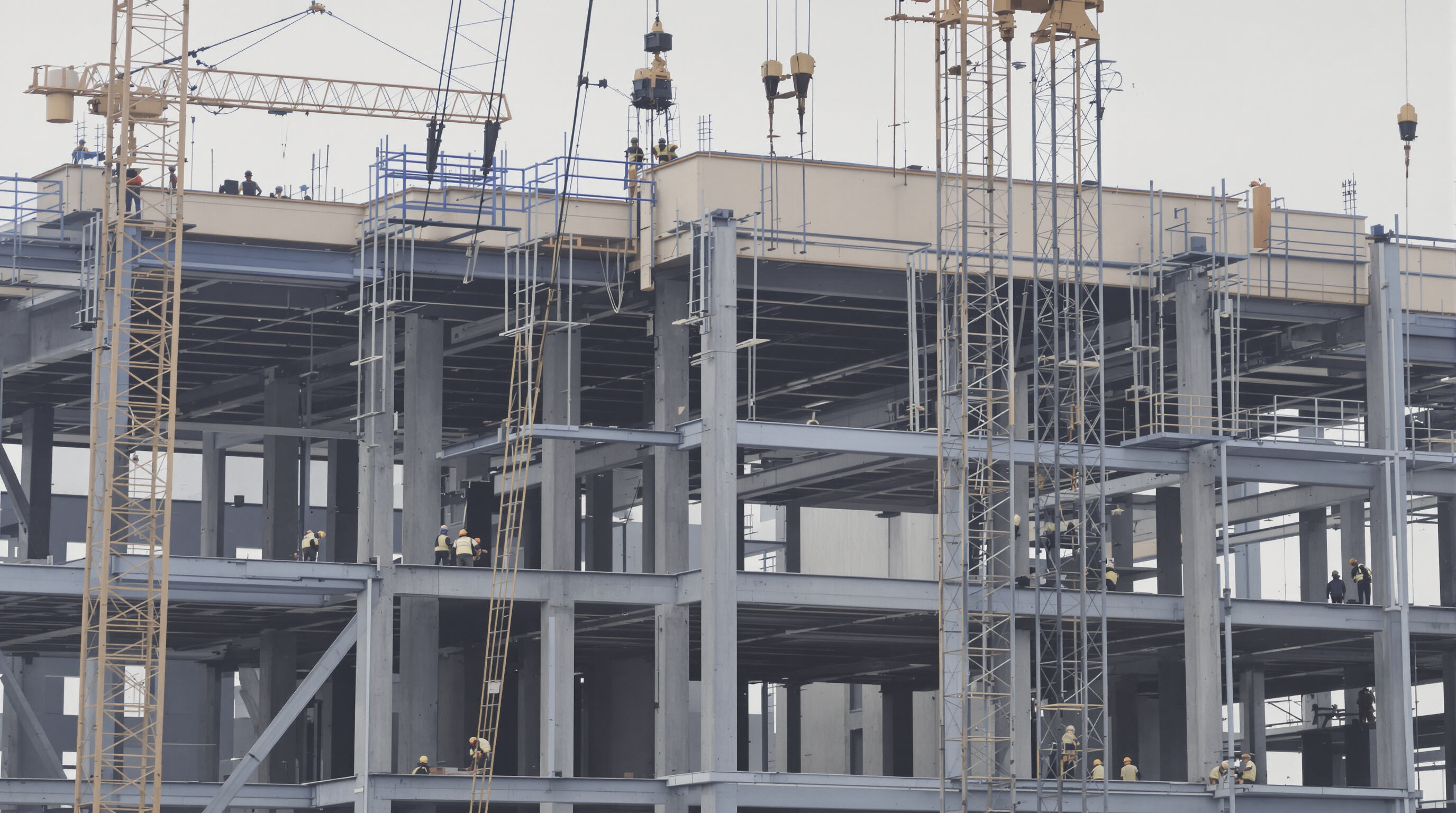 Photorealistic image of workers assembling prefabricated steel structure quickly with cranes at a construction site