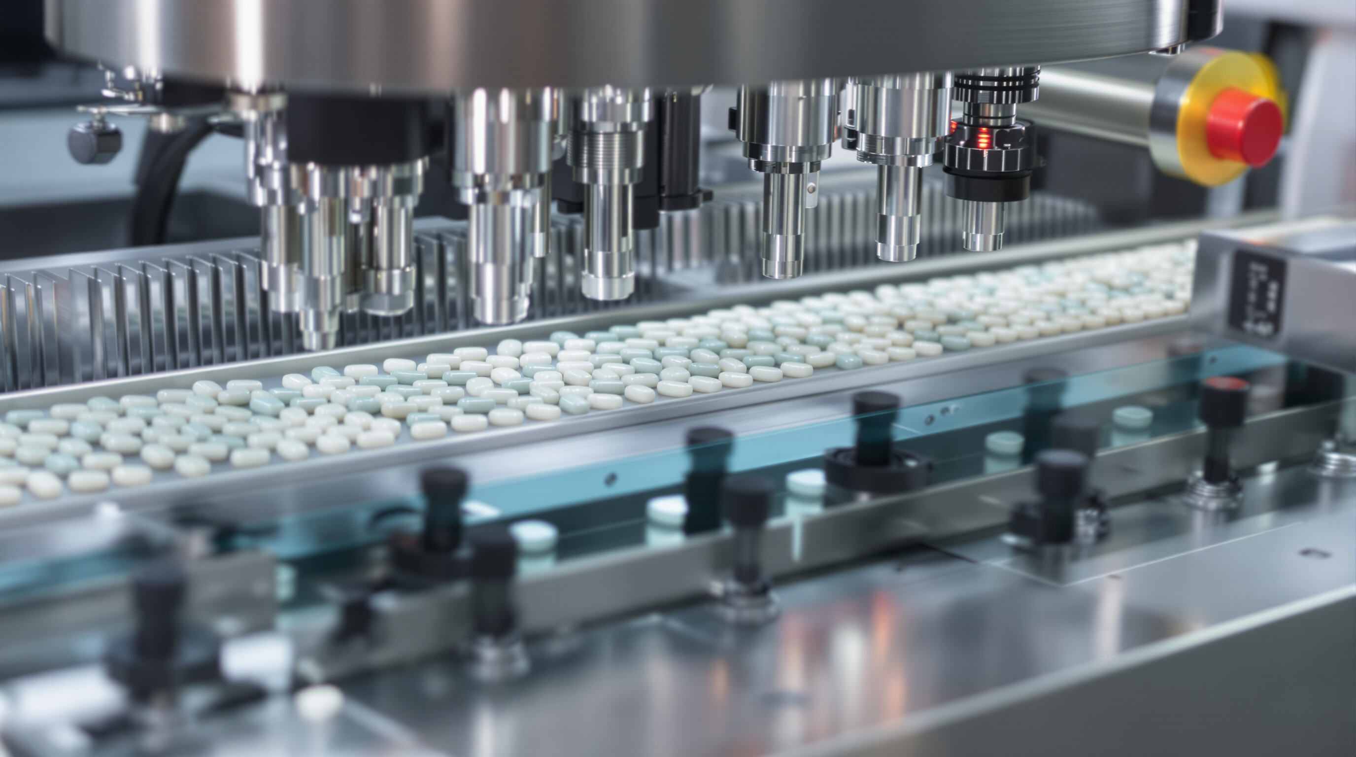 Modern capsule counting machine with conveyors and sensors in a clean pharmaceutical setting