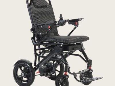What are the compatibility standards for electric wheelchairs used in air travel?