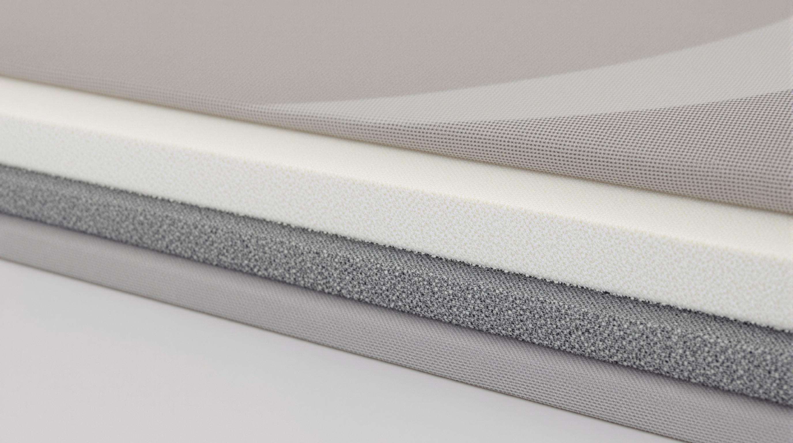 Detailed close-up of Soft-Rigid Unified Structure fabric showing alternating flexible and rigid areas