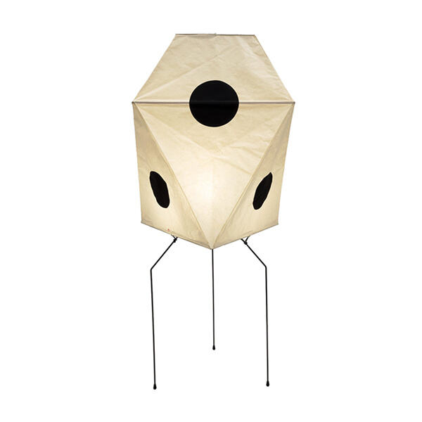 Let the soft glow of a tall paper lamp illuminate your room