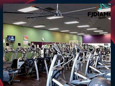 Direct-drive HVLS pole fan maximizing coverage in large industrial plants