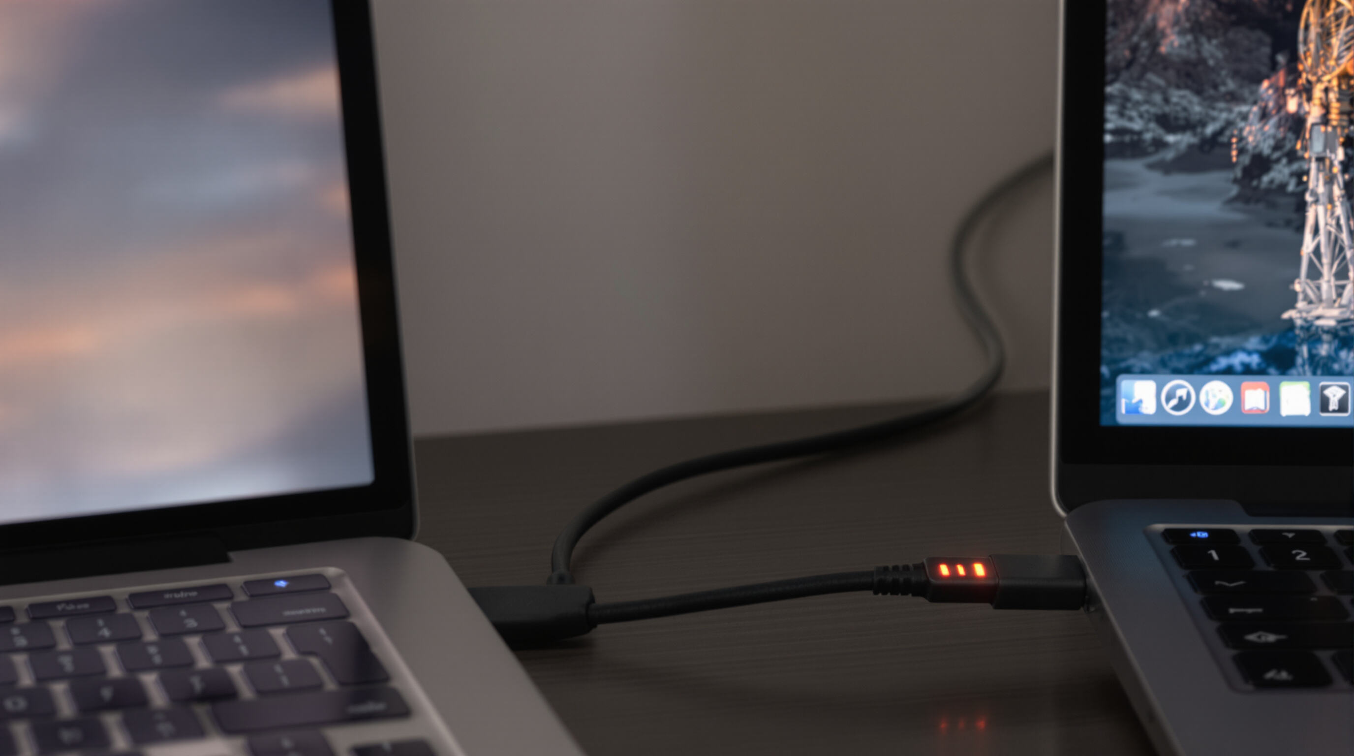 Rechargeable fan charging via USB-C next to a laptop, illustrating battery convenience.