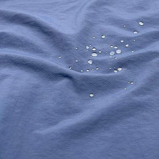 ¿Cuáles son los beneficios clave del uso del tejido Nylon Taslan en prendas de vestir?