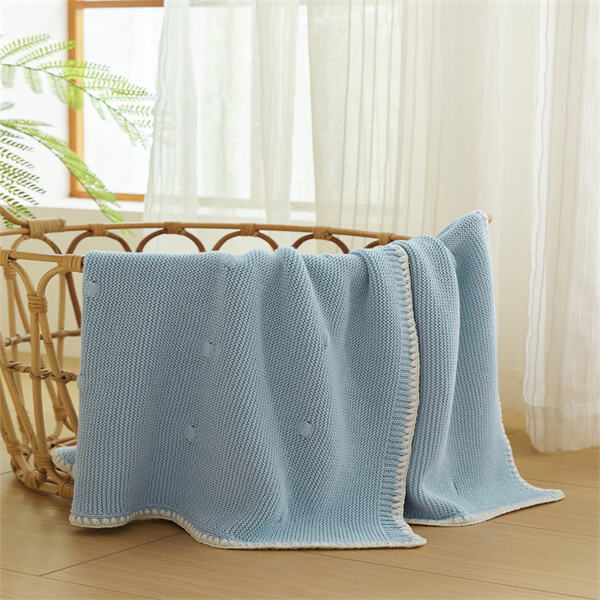 Stay stylish and practical with a soft and durable knitted pram blanket.