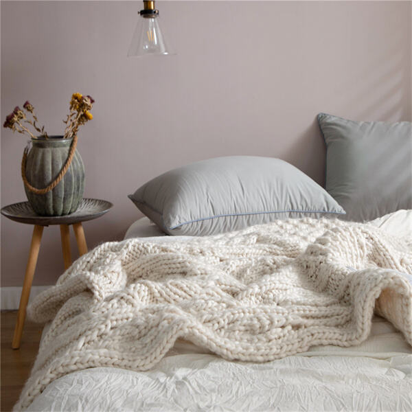 Bring a touch of rustic charm to your decor with a handmade chunky knit blanket.