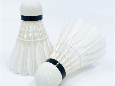 How composite cork bases compare to natural cork in badminton shuttlecocks