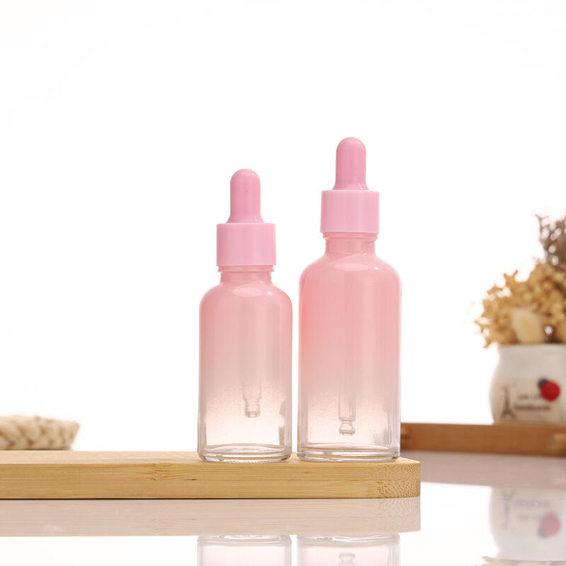 Pink gradient essential oil bottle