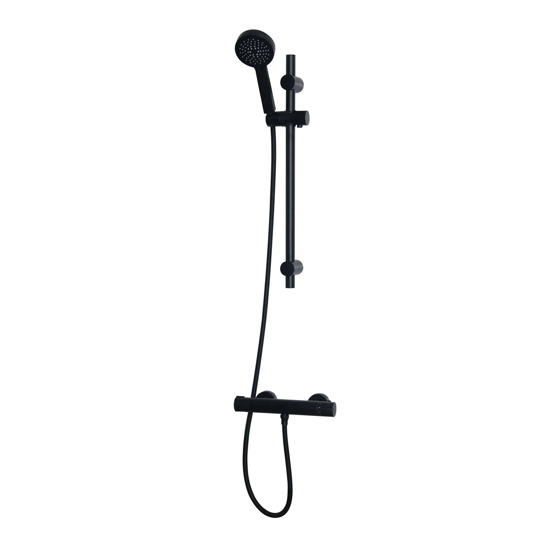 What are the key differences between thermostatic and manual shower systems?