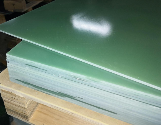 How do temperature and humidity affect the dimensional stability of epoxy fiberglass laminate?