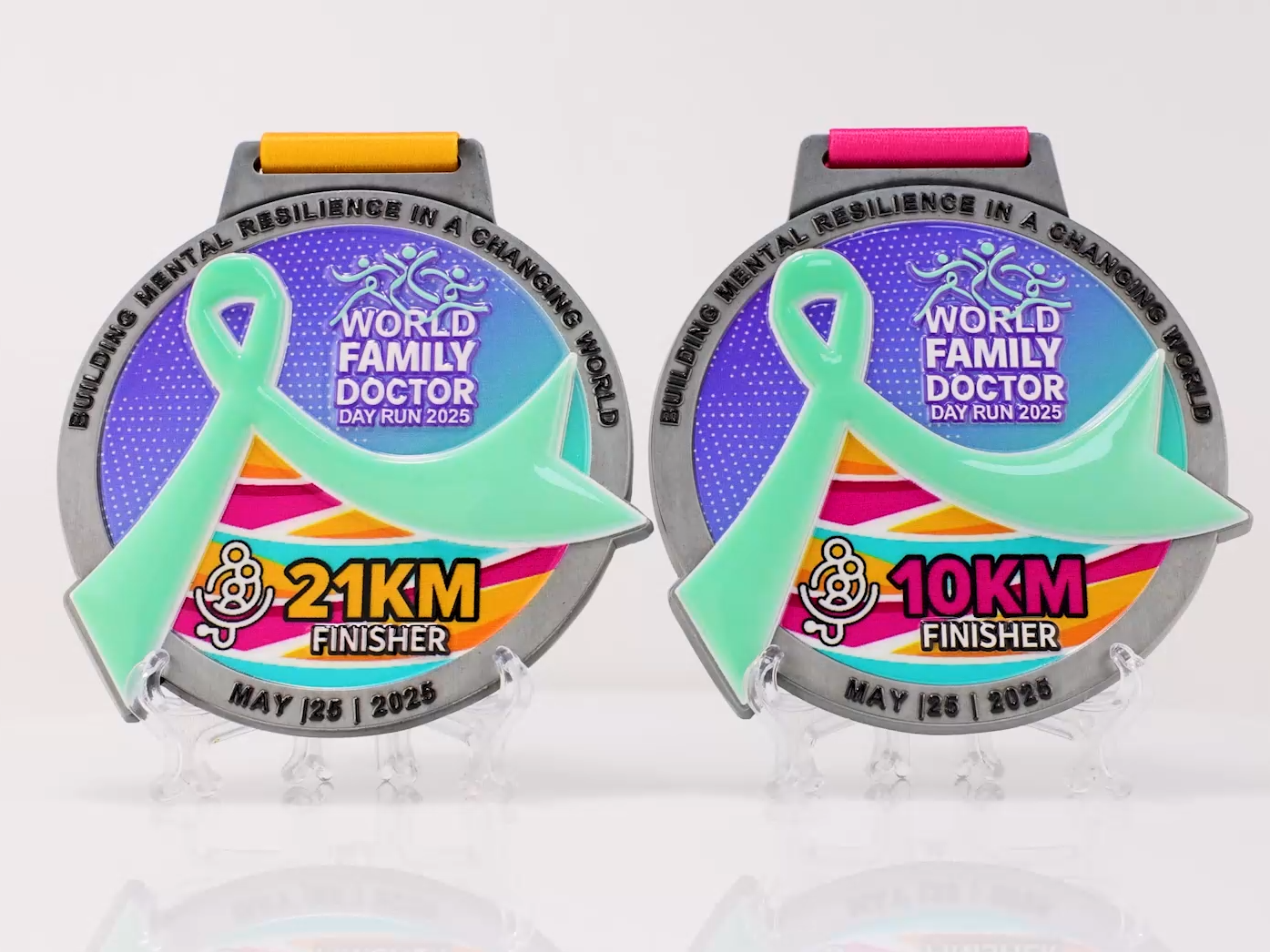 Finisher's medals from the 2025 World Family Doctor Day running event, available in both 21km and 10km versions.