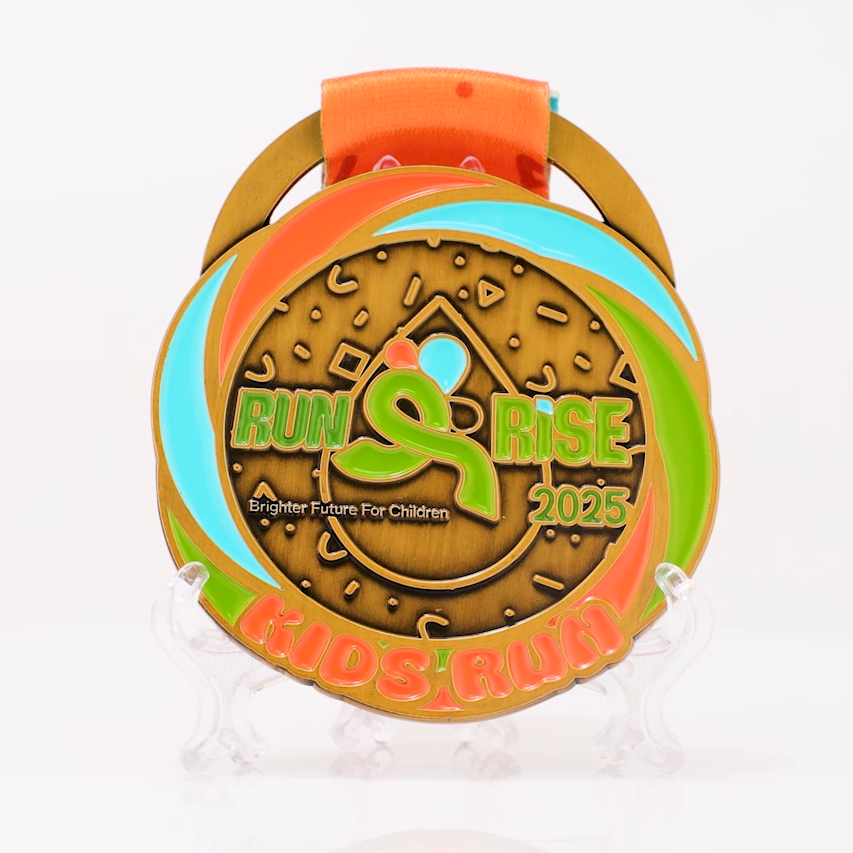 This is a charity running medal, emphasizing how running empowers children to grow stronger.