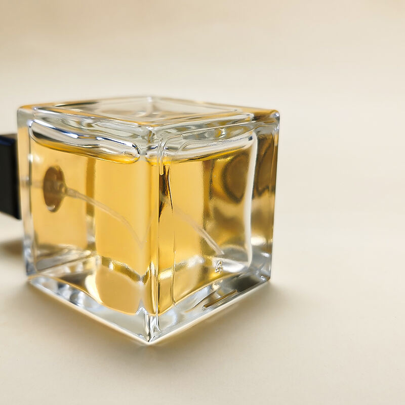 Umweltfreundliche Luxus Quadratische Transparente Leere 100ml Glas Parfumflasche Mit Schwarzen Goldenen Verschlüssen