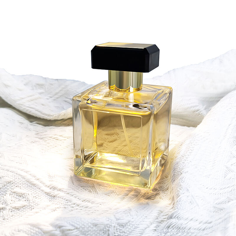 Umweltfreundliche Luxus Quadratische Transparente Leere 100ml Glas Parfumflasche Mit Schwarzen Goldenen Verschlüssen