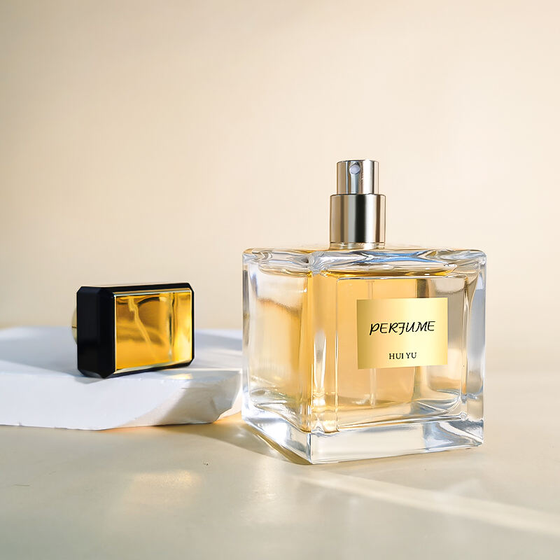 Umweltfreundliche Luxus Quadratische Transparente Leere 100ml Glas Parfumflasche Mit Schwarzen Goldenen Verschlüssen