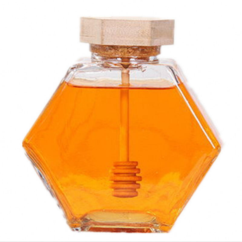 Clear empty glass honey jar with wooden lid