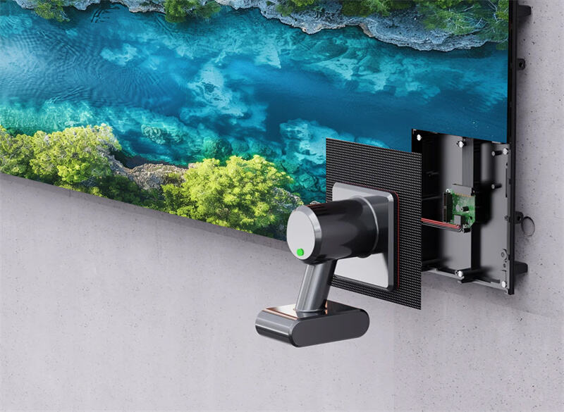 A technician using a specialized vacuum suction tool to safely remove and replace a magnetic LED module from a true front access indoor video wall.