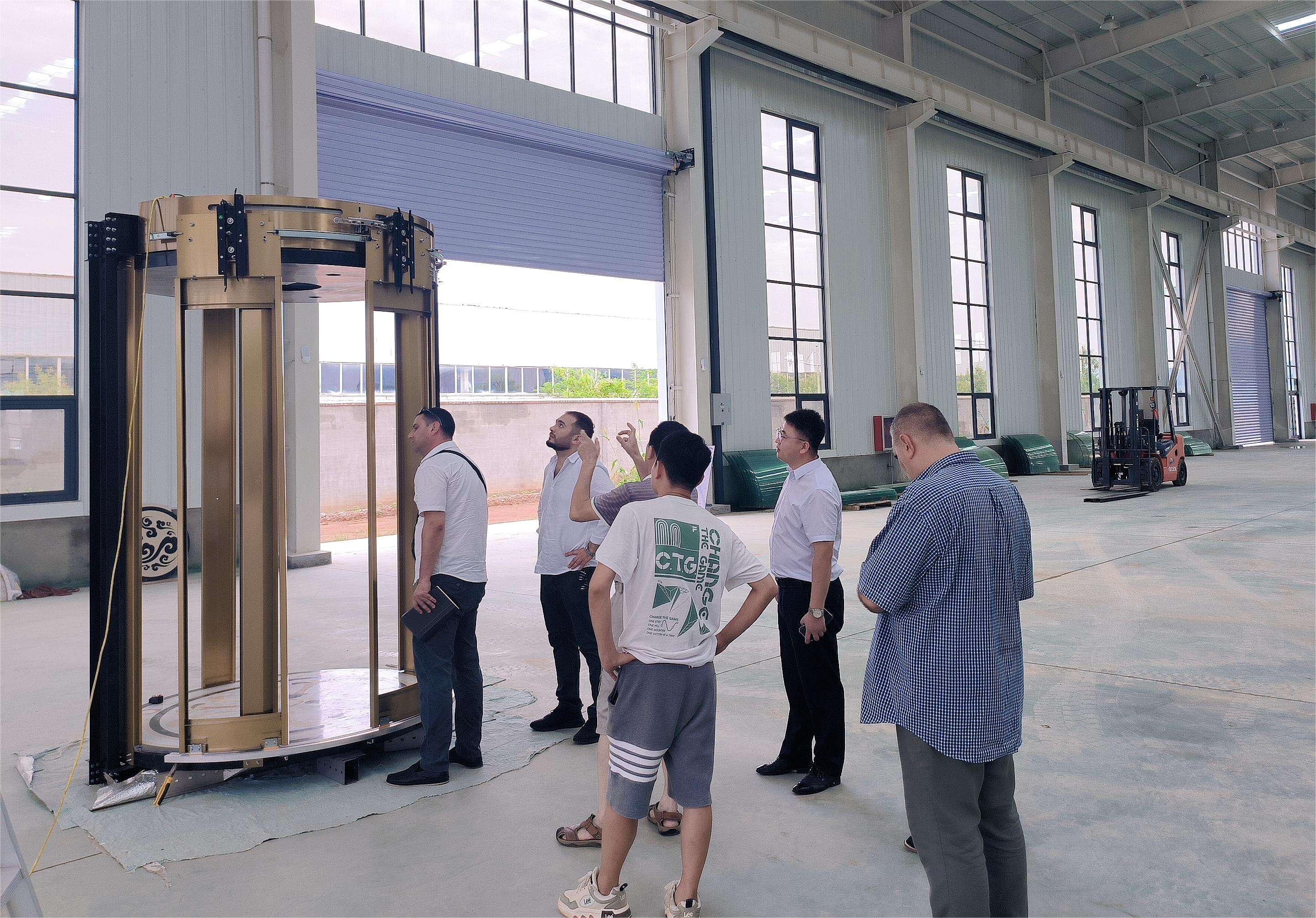 Azerbaijan customers visit our factory to accept the round villa elevator