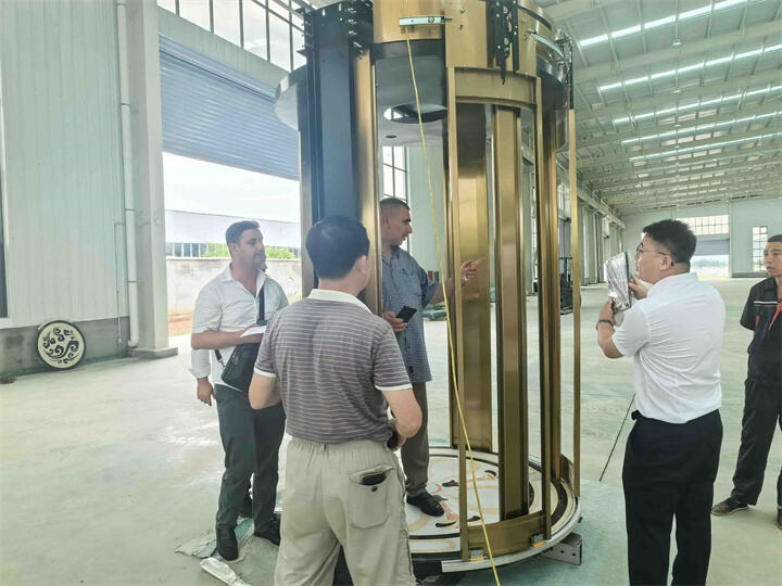 Azerbaijan customers visit our factory to accept the round villa elevator