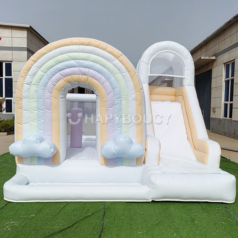 Maison de saut arc-en-ciel couleur claire avec toboggan et piscine à balles pour enfants