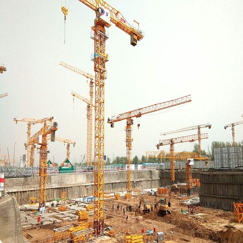 Flat-Top Tower Cranes with Optimal Reach for Construction Sites with Height Limitations