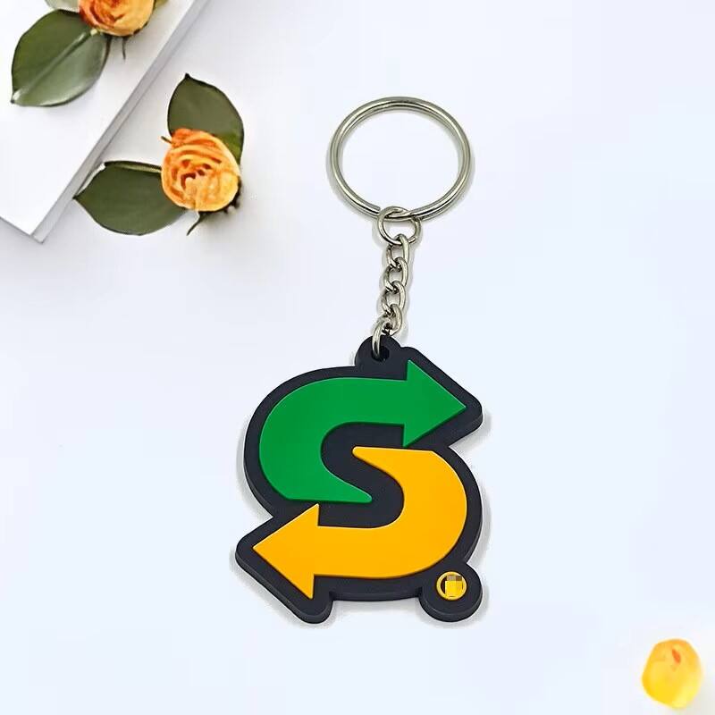 Personalized promotional custom soft pvc logo 2D rubber gift key chain custom logo letter logo pvc keychain.jpg