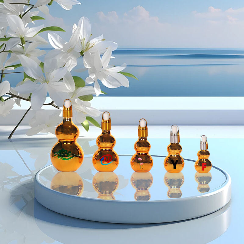 Sell 10ml 20ml 30ml 50ml 100ml luxury gourd shaped gold plated glass essential oil bottle with dropper cap