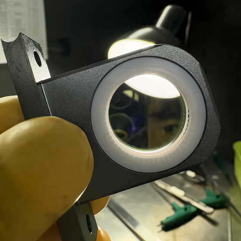 How often should you change the fiber laser protective lens?