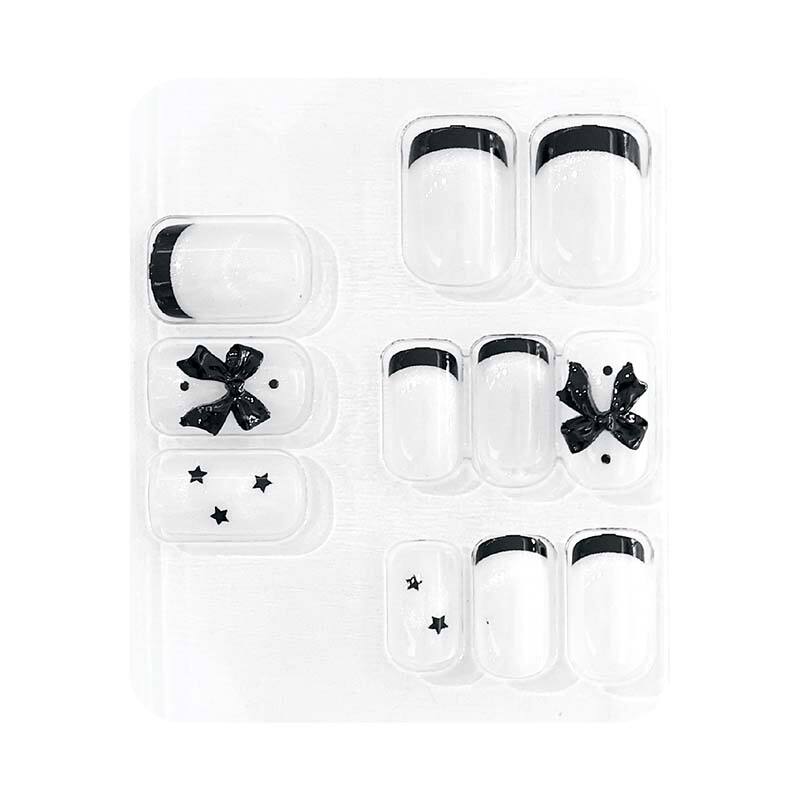 Faux ongles avec motif nœud papillon noir et blanc