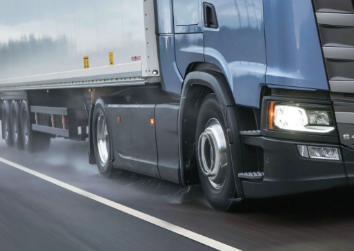 How do truck tires improve fuel efficiency for long-haul transport?