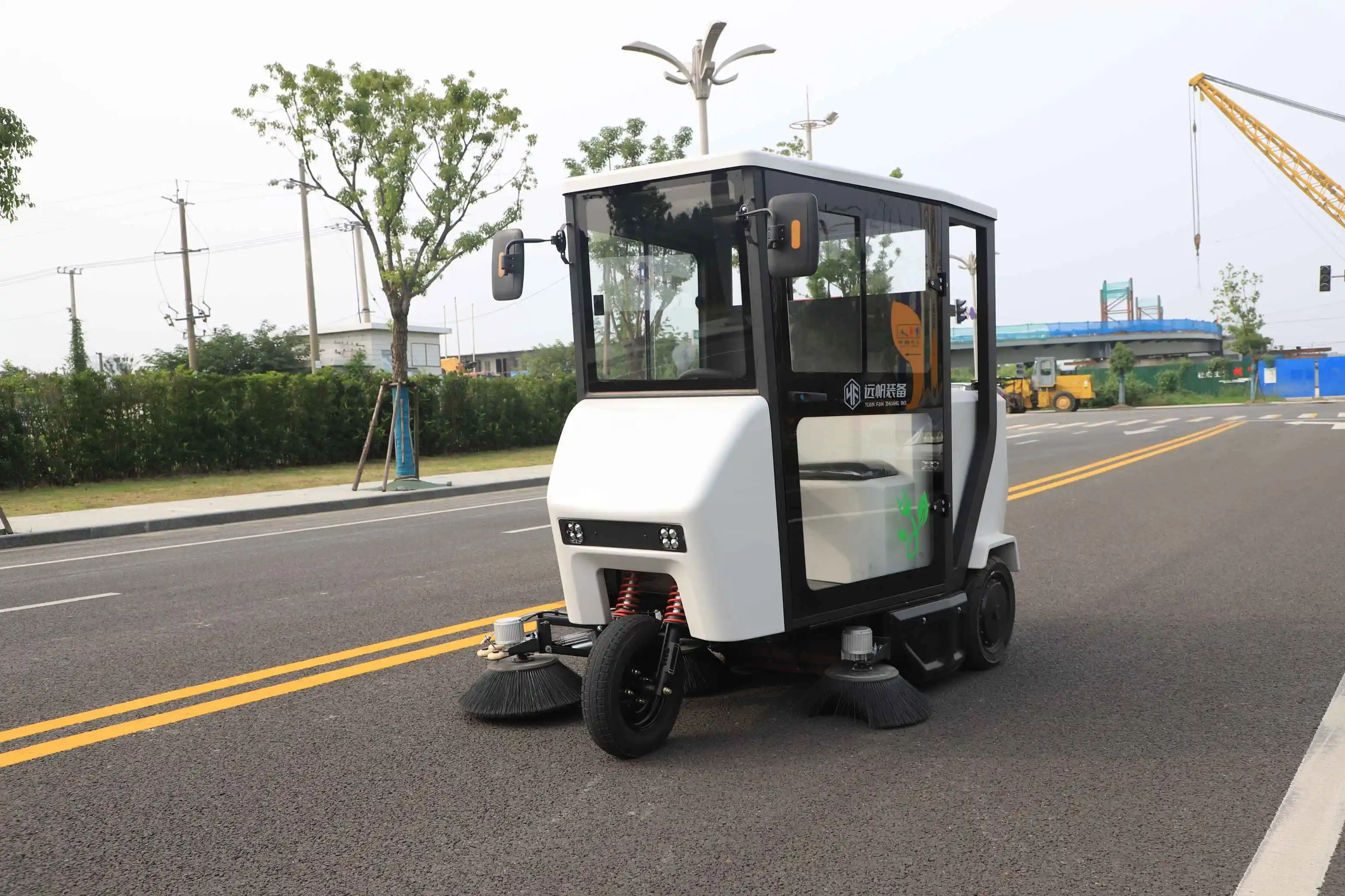 How do mechanical street sweepers differ from manual broom sweeping?