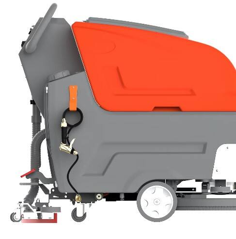 How do ride-on floor scrubbers differ from walk-behind models?