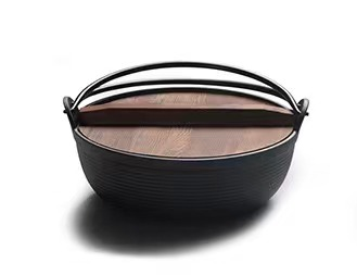 cast iron pot with wood lid