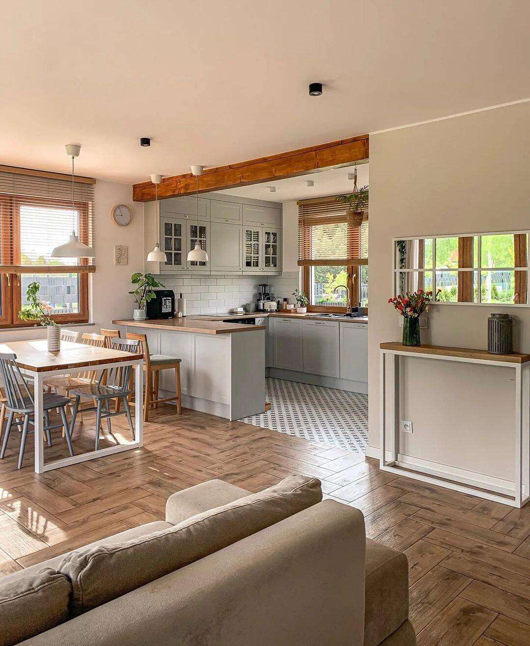Light Gray Kitchen Cabinets with Wooden Countertops and Glass - Paneled Doors for a Bright and Open Concept Kitchen - Living Space
