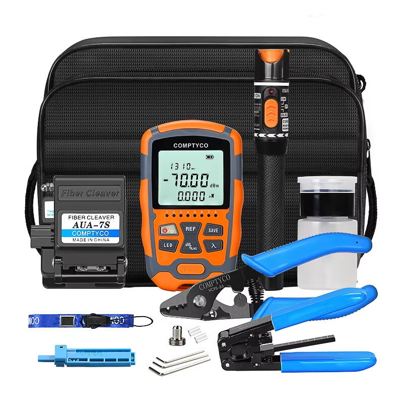 What are the essential tools included in an FTTH Fiber Tool Kit?