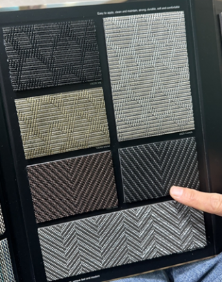Customizable floor carpet samples for vehicles displayed.