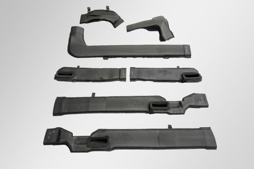 A series of plastic car parts.