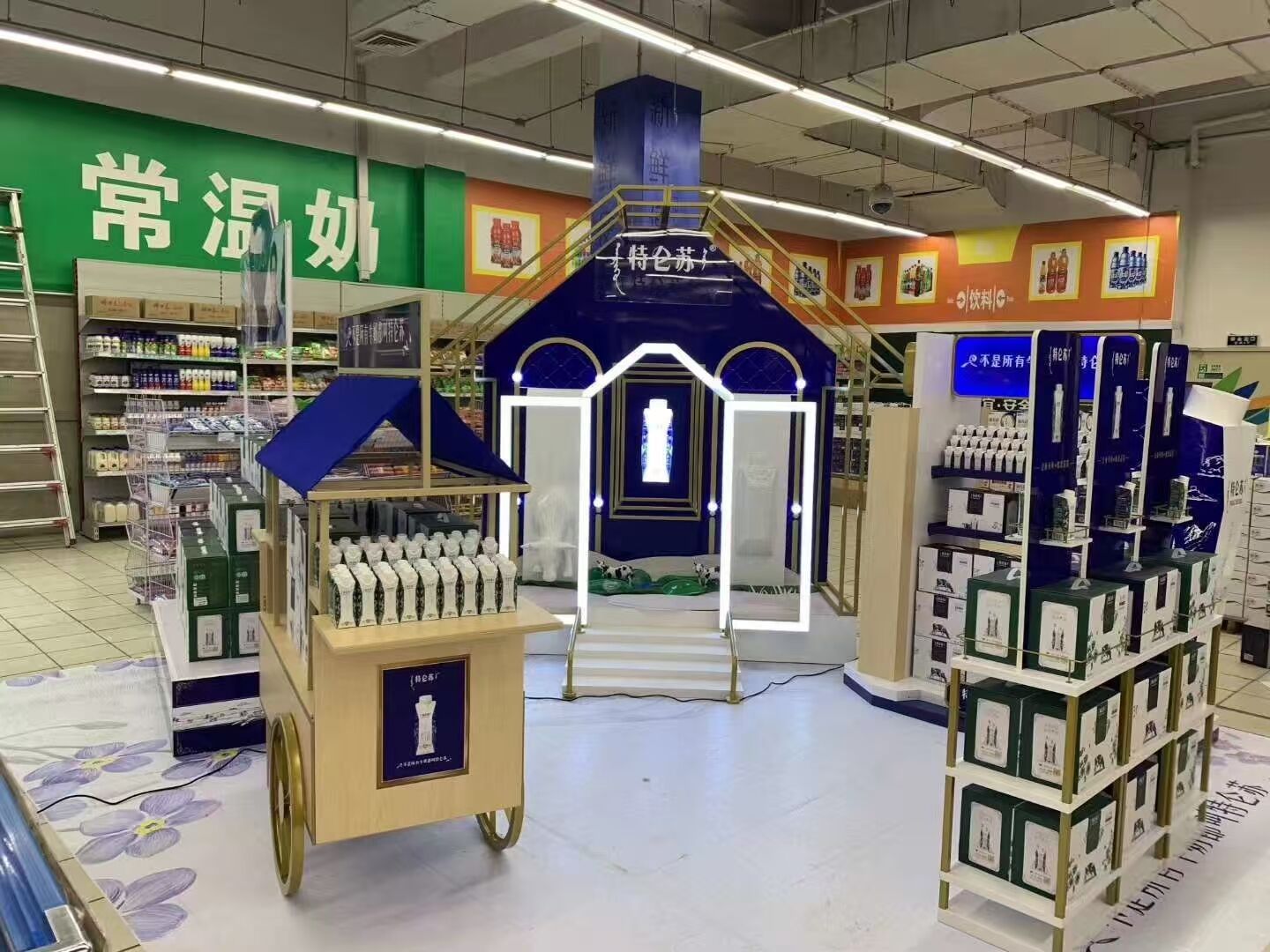 Retail display zone for ambient milk with branded shelving and POP display structure in supermarket.jpg