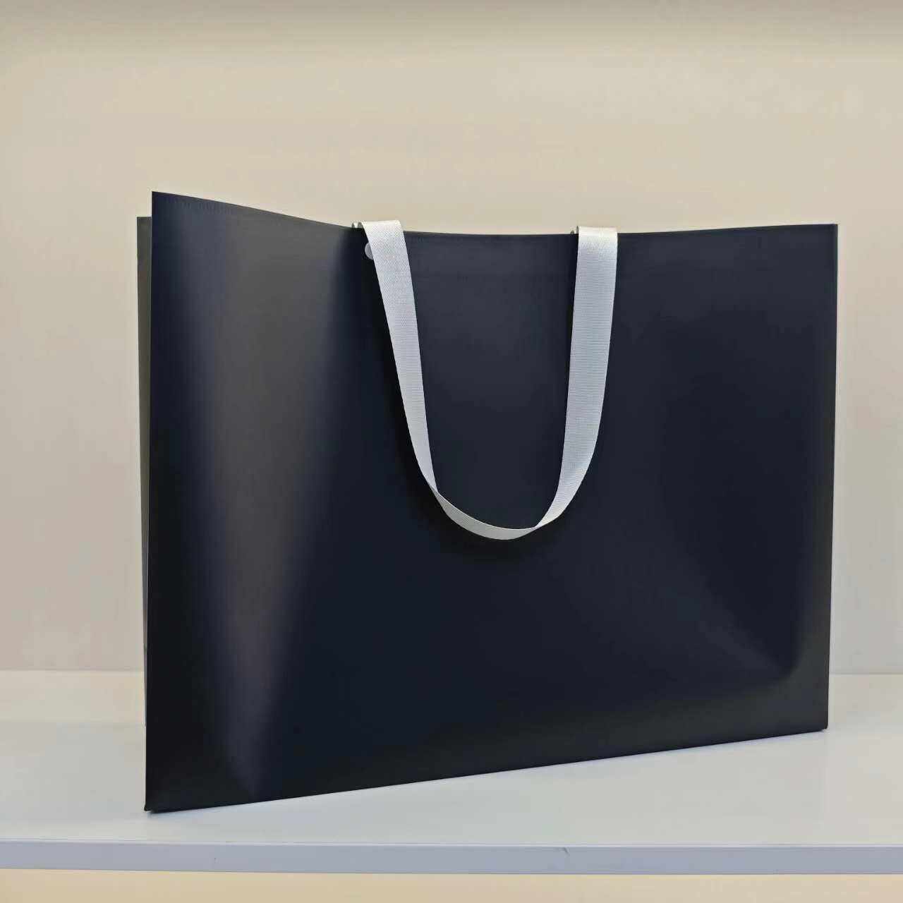 2.Shoulder Carrying Plastic Shopping Tote Bag with Webbing Belts for Clothing Gift Packing