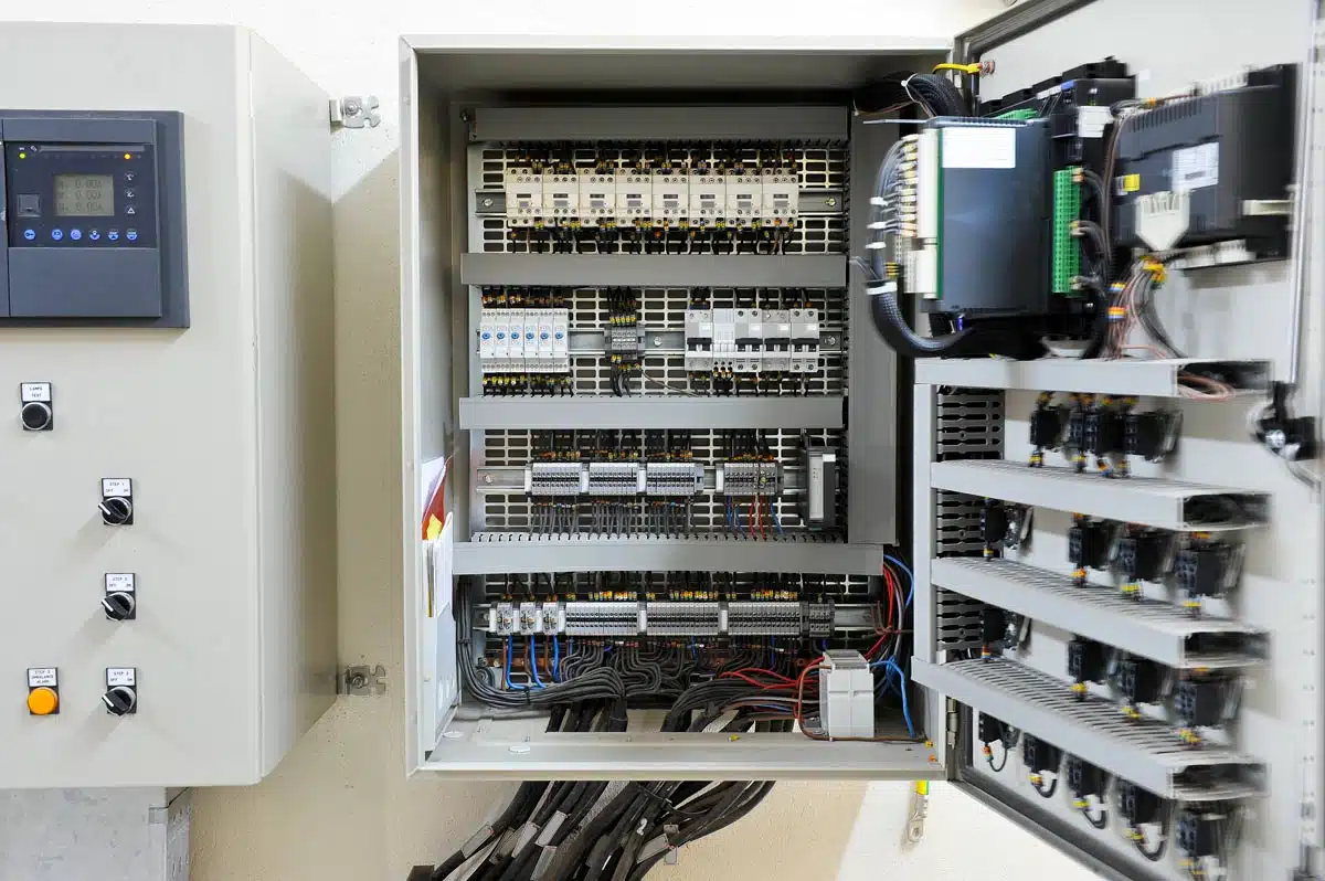 An electrical room in a commercial building showing multiple low voltage panels.