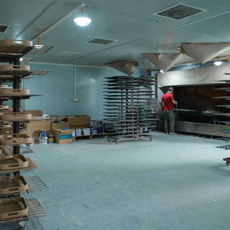 The automated painting system area, where we apply specialized, wear-resistant coatings to ensure long-lasting color consistency and durability for high-traffic hotel use..jpg