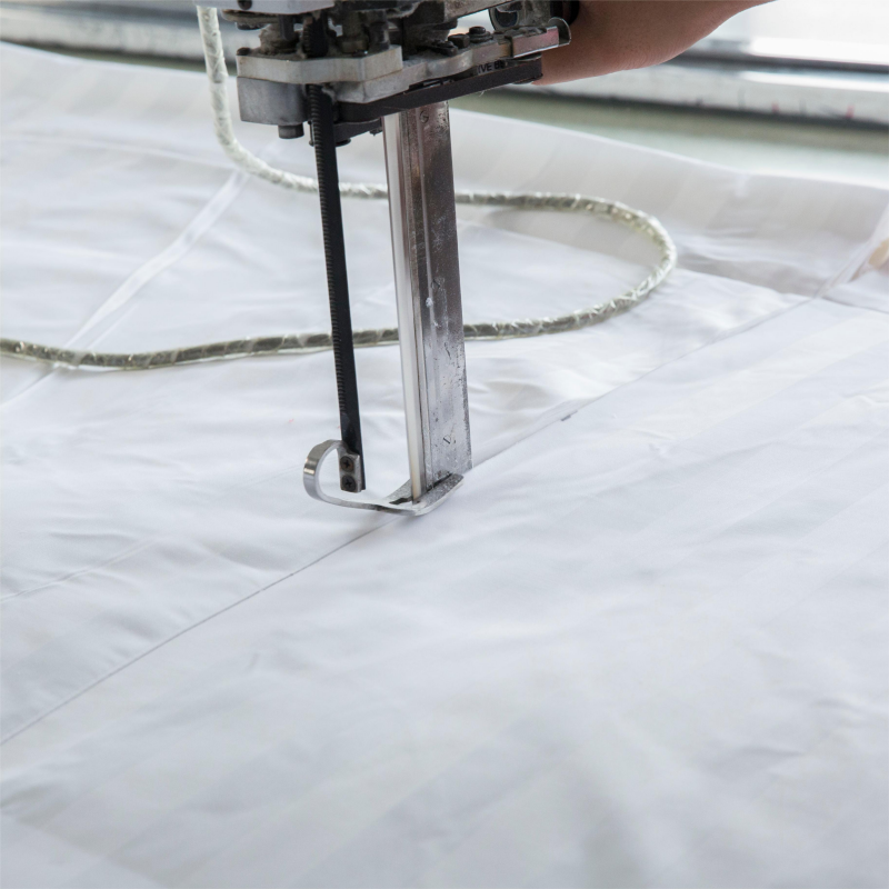 Precision cutting of hotel fabric using advanced machinery for consistent sizing and quality.jpg