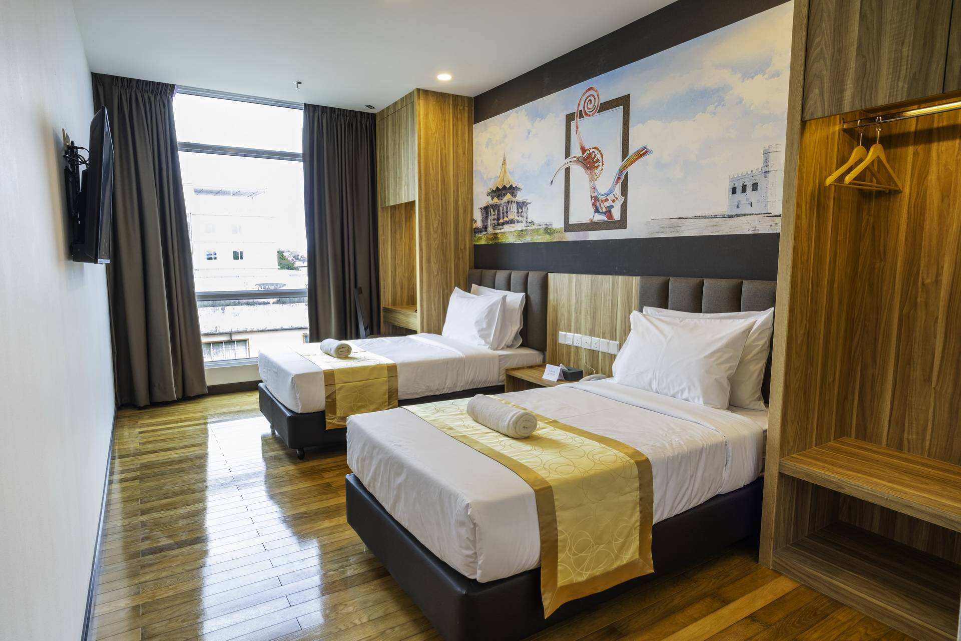 An interior view of a clean, modern twin guest room at Malaysia City Rise Hotel, illustrating Taitang's role as a trusted hospitality bedding suppliers and bed linen manufacturer..jpg